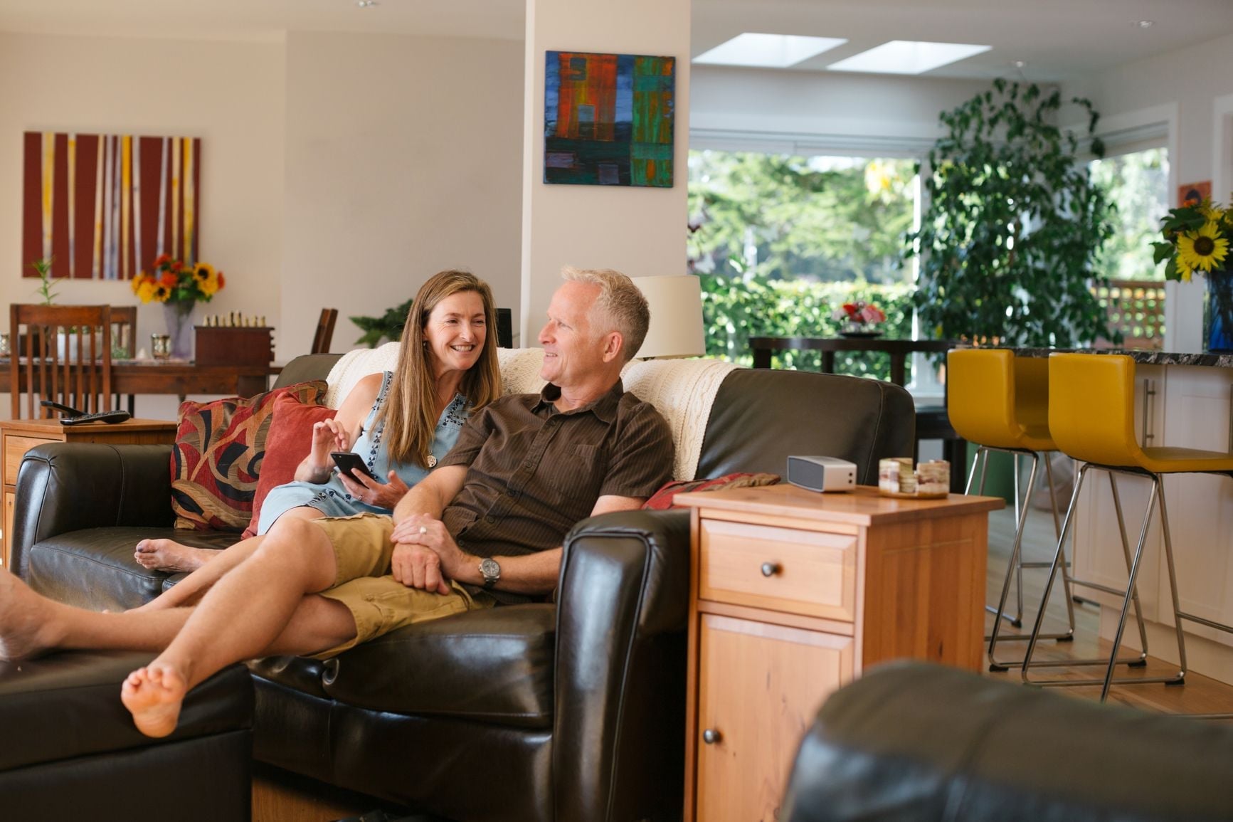 Two people relaxing together in a living room
